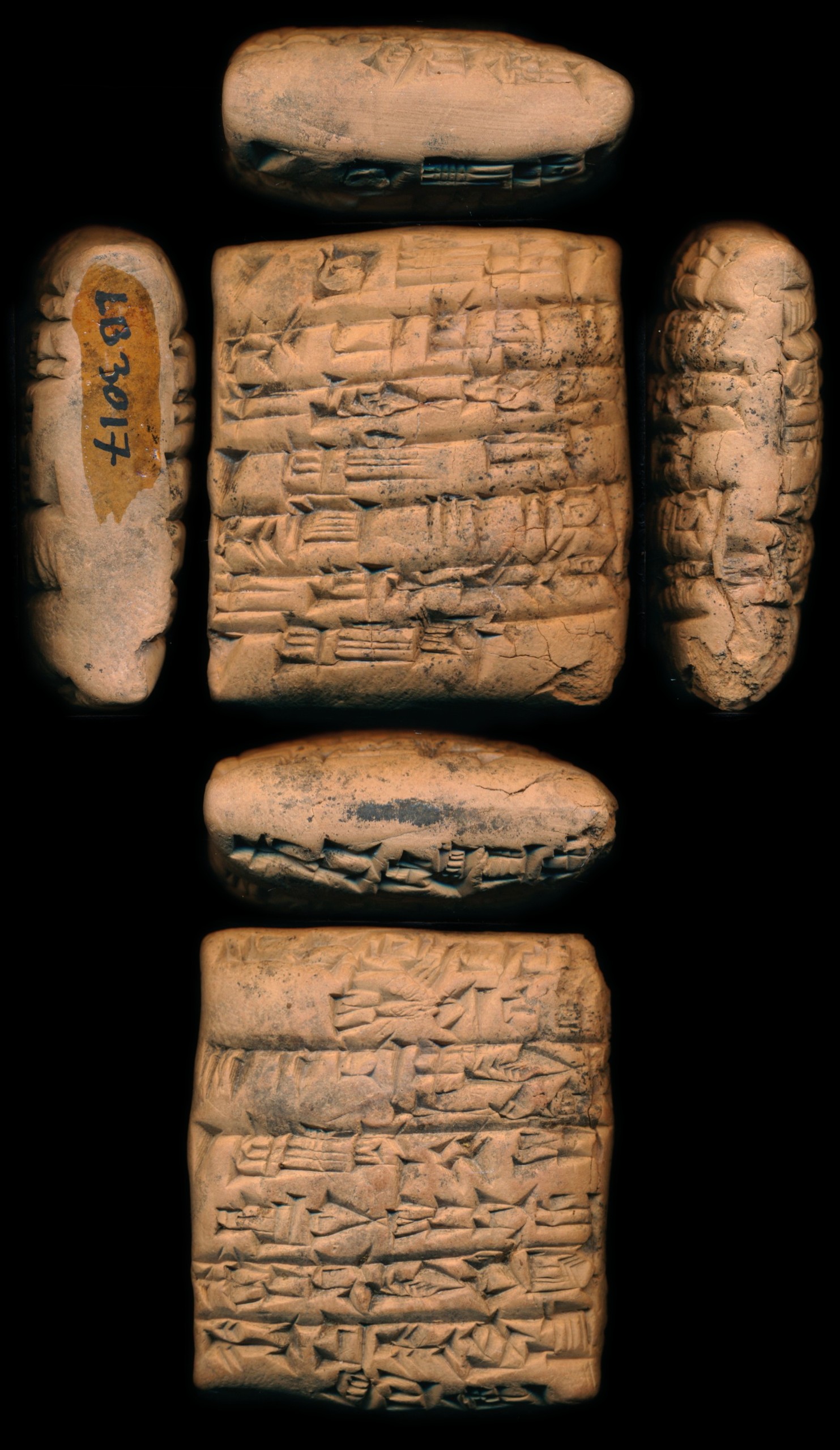 Clay tablet from Umma listing garments issued to four workers, two of them marked “from flight”